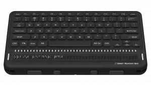 Photo showing an top view of the Orbit Reader Q40 Refreshable 20-cell Braille Display with an integrated QWERTY keyboard. Shows the words "Orbit Reader Q40" in braille on the braille display. The picture shows the QWERTY keyboard on top of the unit, along with cursor routing buttons and thumb keys on the side