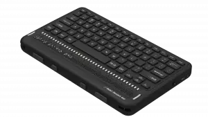 Photo showing an angled perspective view of the Orbit Reader Q40 Refreshable 20-cell Braille Display with an integrated QWERTY keyboard. Shows the words "Orbit Reader Q40" in braille on the braille display. The picture shows the QWERTY keyboard on top of the unit, along with cursor routing buttons and power button on side